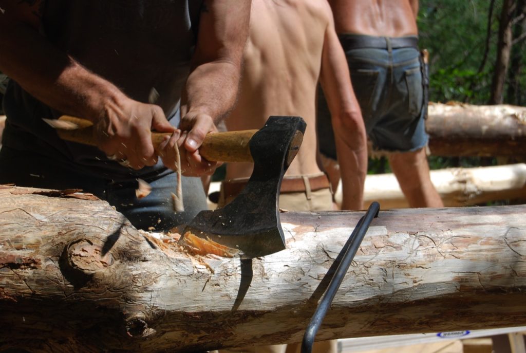Notching a log with a sharp axe