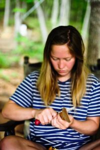 apprentice carving a spoon