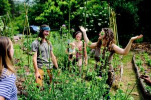 Natalie Bogwalker with apprentices in Wild Abundance garden