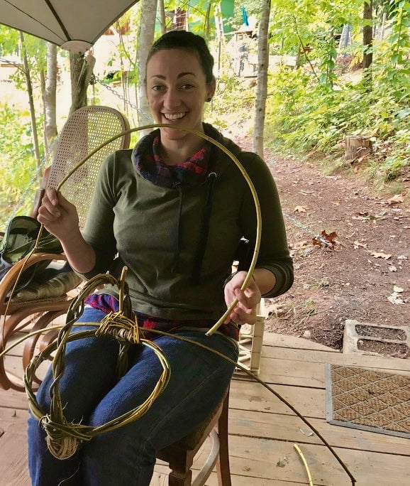 apprentice cate weaving a willow basket