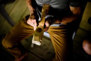 carving a wooden spoon with a knife