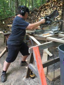 woman using chop saw