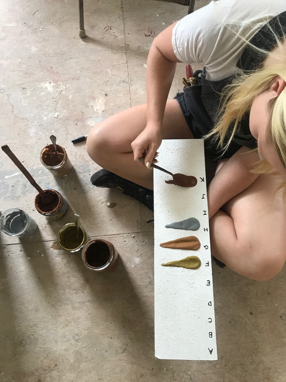 woman making color palatte with DIY paint