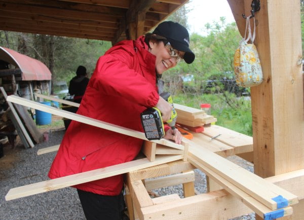 woman building sawhorses in carpentry class