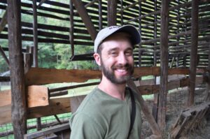 Josh Riley Permaculture Design Course Student in an old tobacco barn