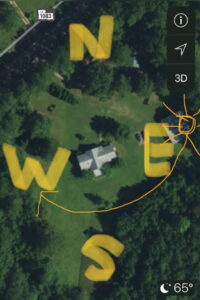 an aerial map of a home with the cardinal directions and path of the sun marked