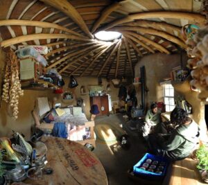 natural building small house with people inside beautiful spiral ceiling