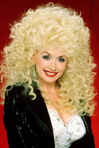 dolly parton with a perm in the eighties