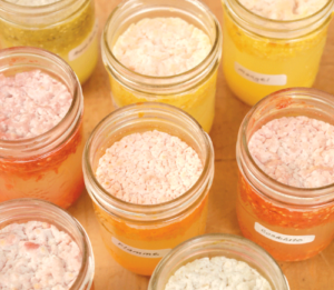 tomato seeds fermenting in jars