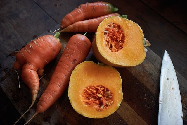 carrots and squash on a cutting board