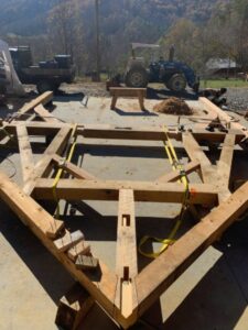  timber frame bent under construction