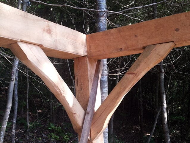 the corner supports and joinery in a timber frame structure.
