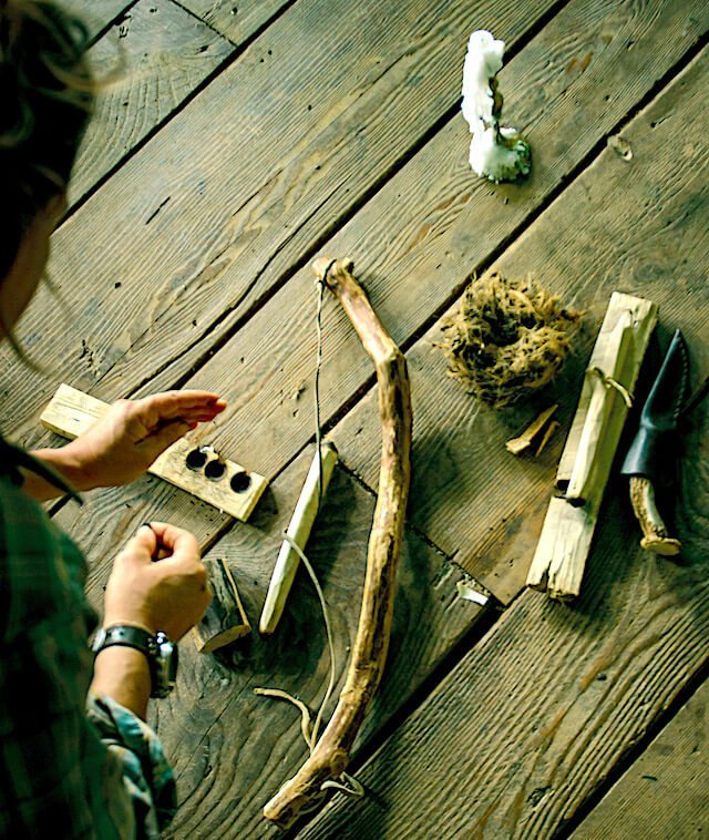 Friction fire tools laid out during survival skills class