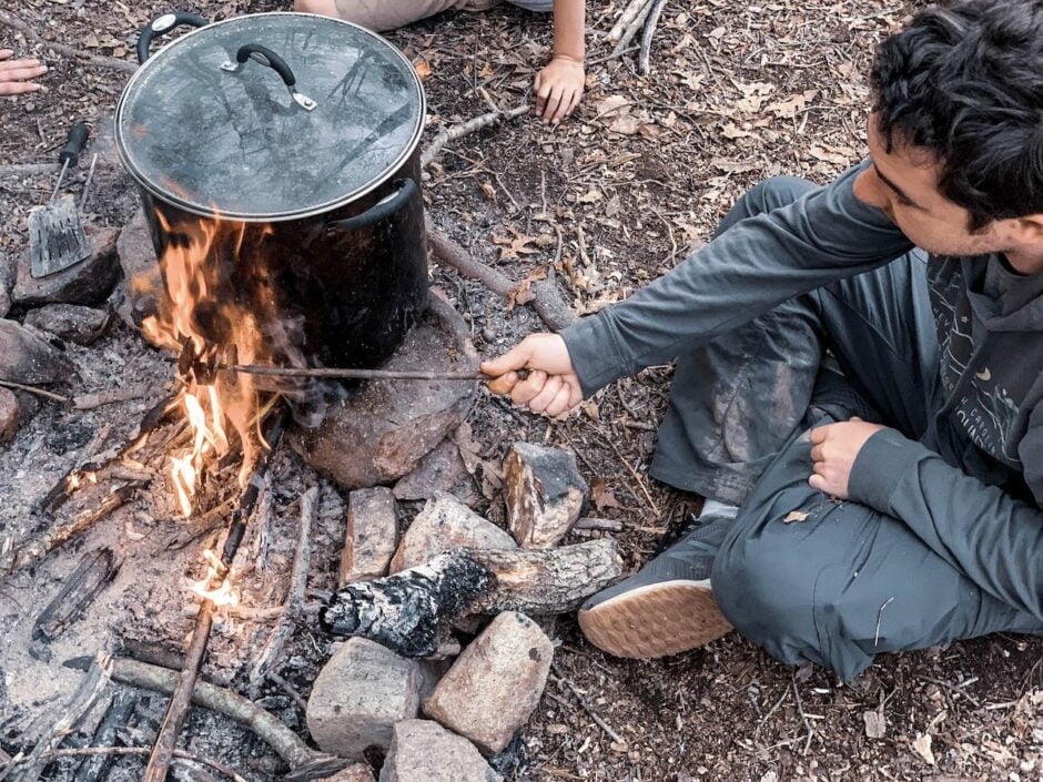 Man cooking over an open fire