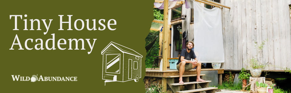Text reads: Tiny House Academy at Wild Abundance. Photo is on right of man sitting in front of tiny house.