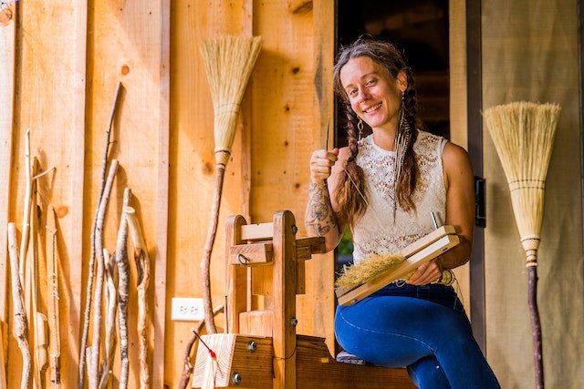 Emileigh Bell Zola at her workshop in the Appalachian mountains where she makes handcrafted brooms and other slow crafts.