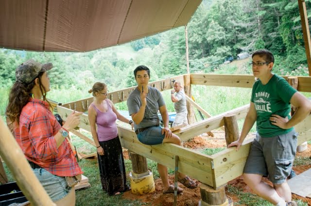 all genders carpentry students building a foundation