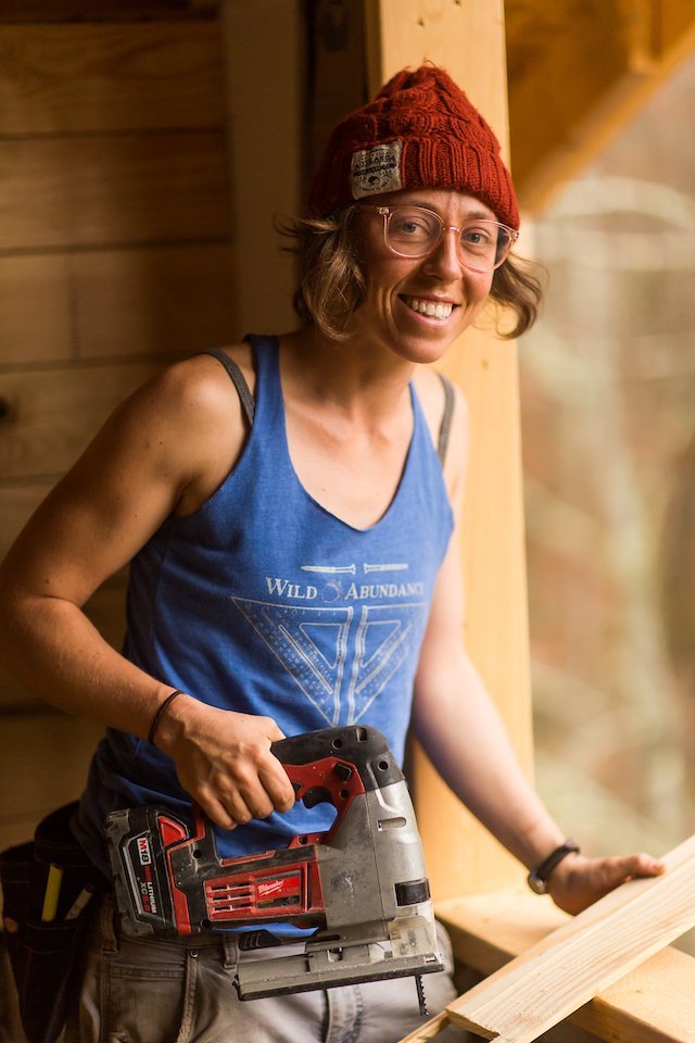 Student in building apprenticeship using a sawzall.