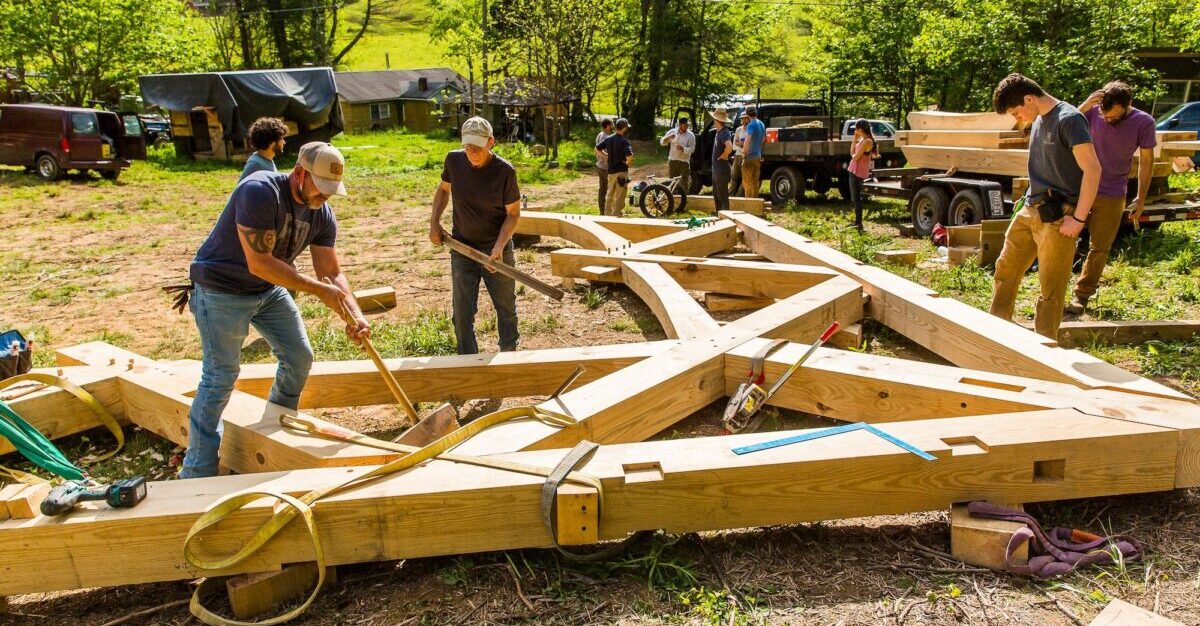 students in a Timber Framing Class at Wild Abundance prepare to raise a bent while building the teaching pavilion for the new campus