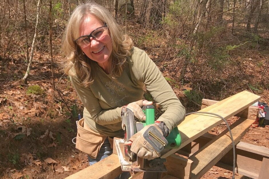 Older woman learning carpentry in a class at Wild Abundance