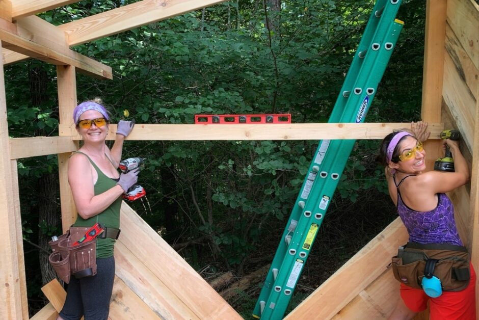two women work on framing out a shed wall during an advanced carpentry class for women