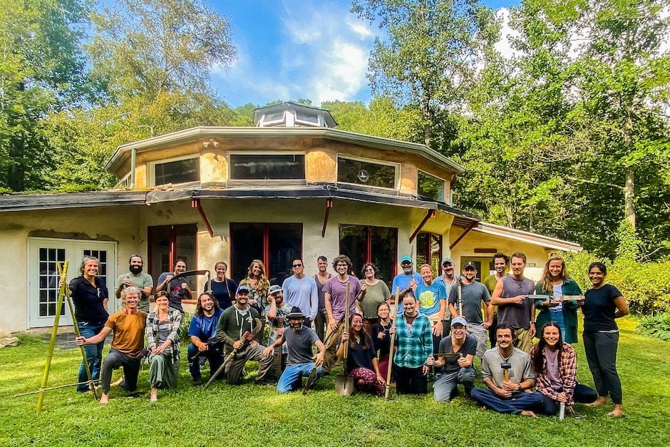 A class photo of about 30 students in the Permaculture Design Certificate Program