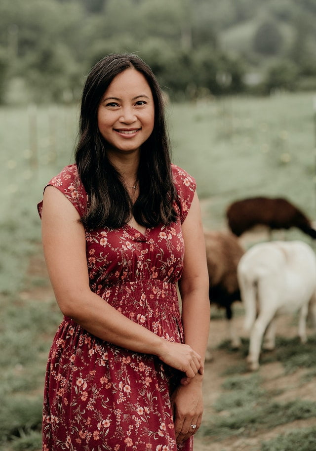 Sophia Eng, Marketing staff at Wild Abundance, at her homestead with livestock in the background 