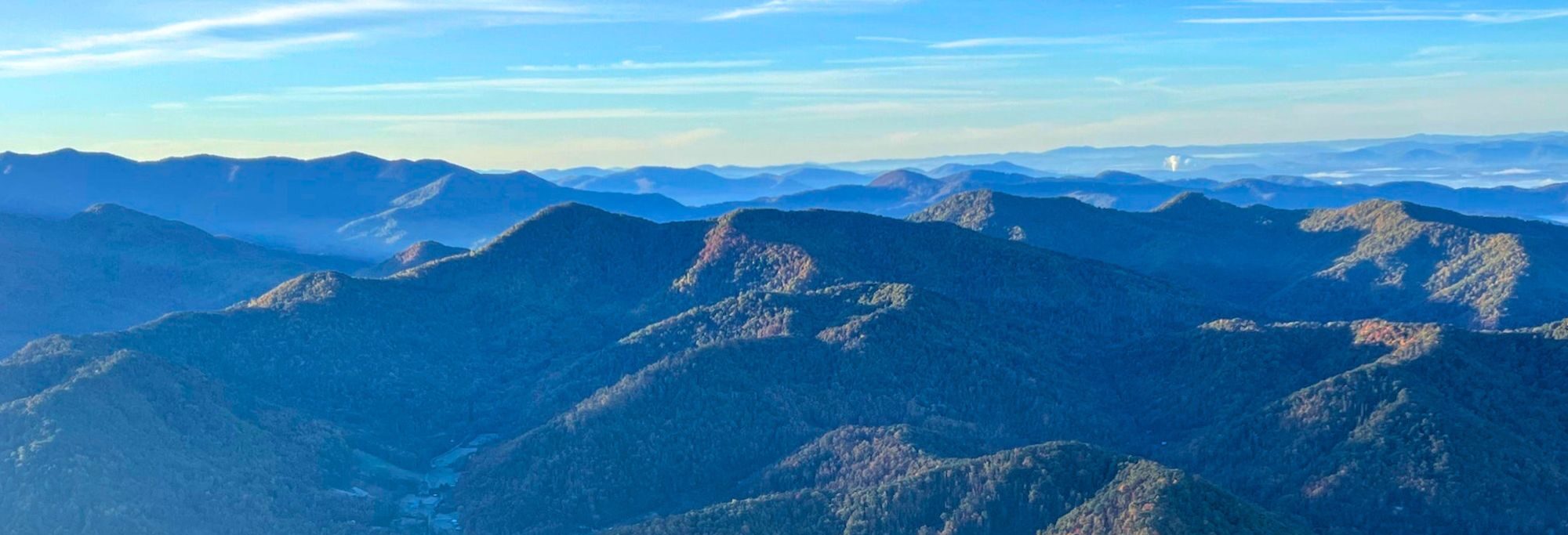 A view of the local mountains from a hot air balloon above the campus of Wild Abundance