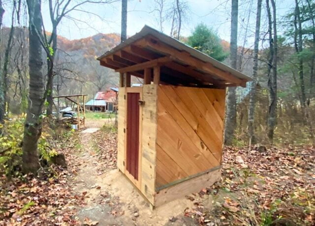 A cozy and private permitted outhouse is provided for students to go to the bathroom during classes
