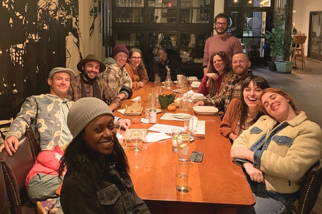 Students and teachers eating out at a restaurant in Asheville, North Carolina after a Wild Abundance workshop