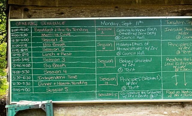 The schedule of a Permaculture Design Certificate course is posted daily on a blackboard in the center of campus at Earthaven Ecovillage