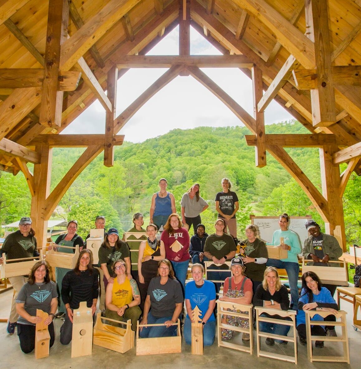 005_WBC group photo May 11 2025-women's basic carpentry class at Wild Abundance Women's Basic Carpentry class group photo with final projects at Wild Abundance