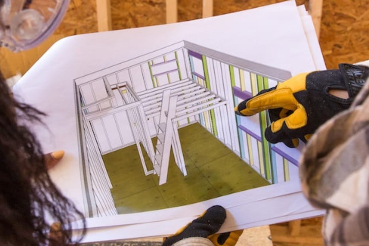REGISTRATION HEADER 768 x 512 - 5 students look at a tiny house plan set as they build it