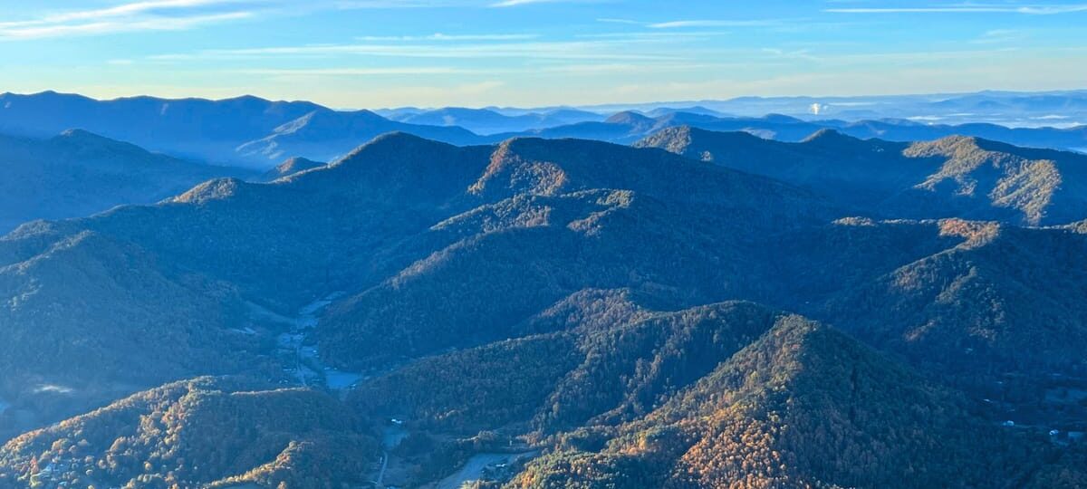 Aerial view of the misty Mountains of Western North Carolina near Wild Abundance DIY skills educational center