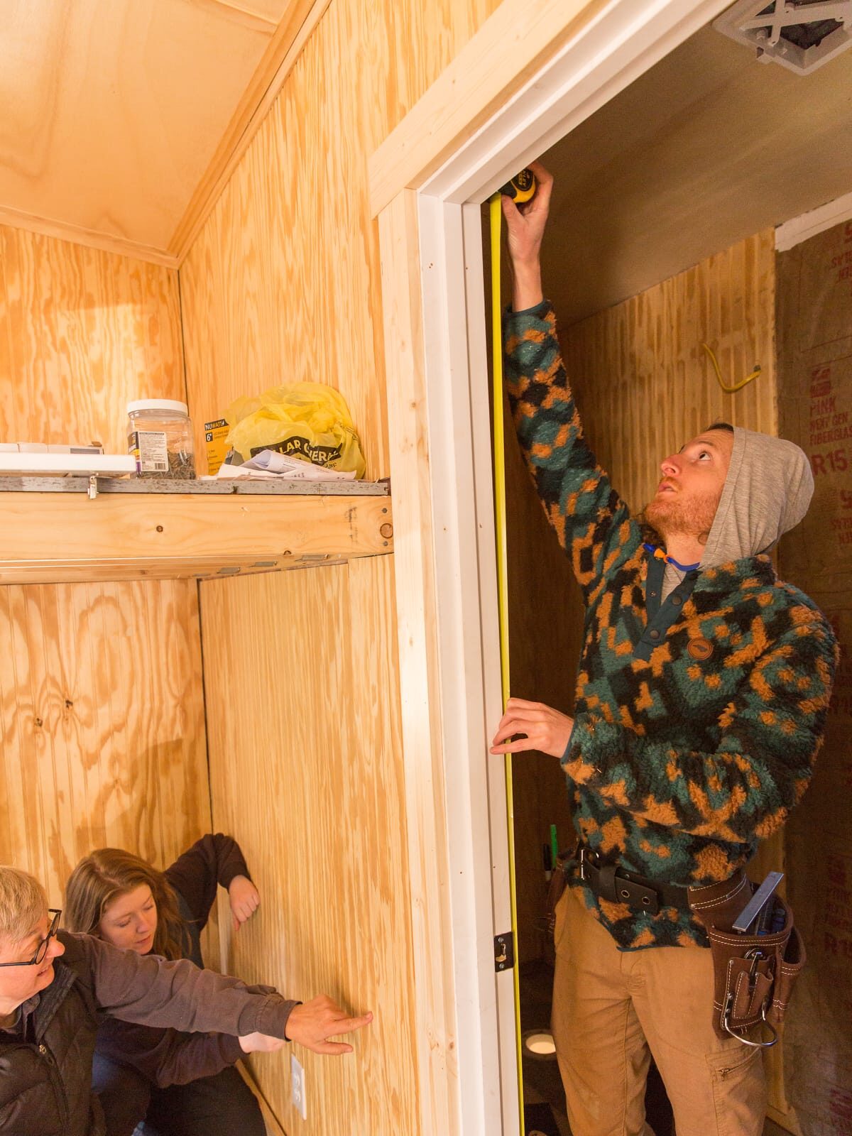 Nonprofit-1200-Current-614 Carpentry students in a WIld Abundance training program work on the finishing details on the interior of a Tiny Home they are building to donate to a person in need of a home.