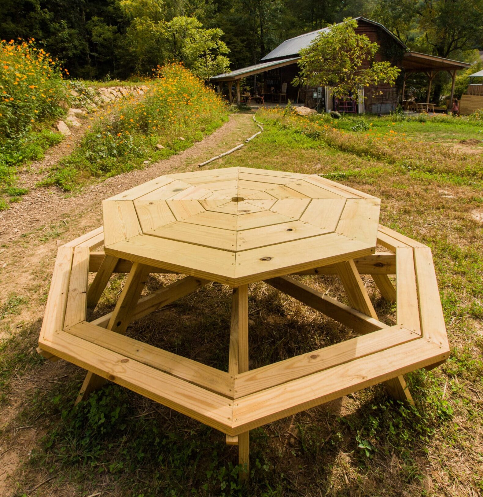 A picnic table built by students in a basic carpentry workshop group project on the campus of Wild Abundance in North Carolina