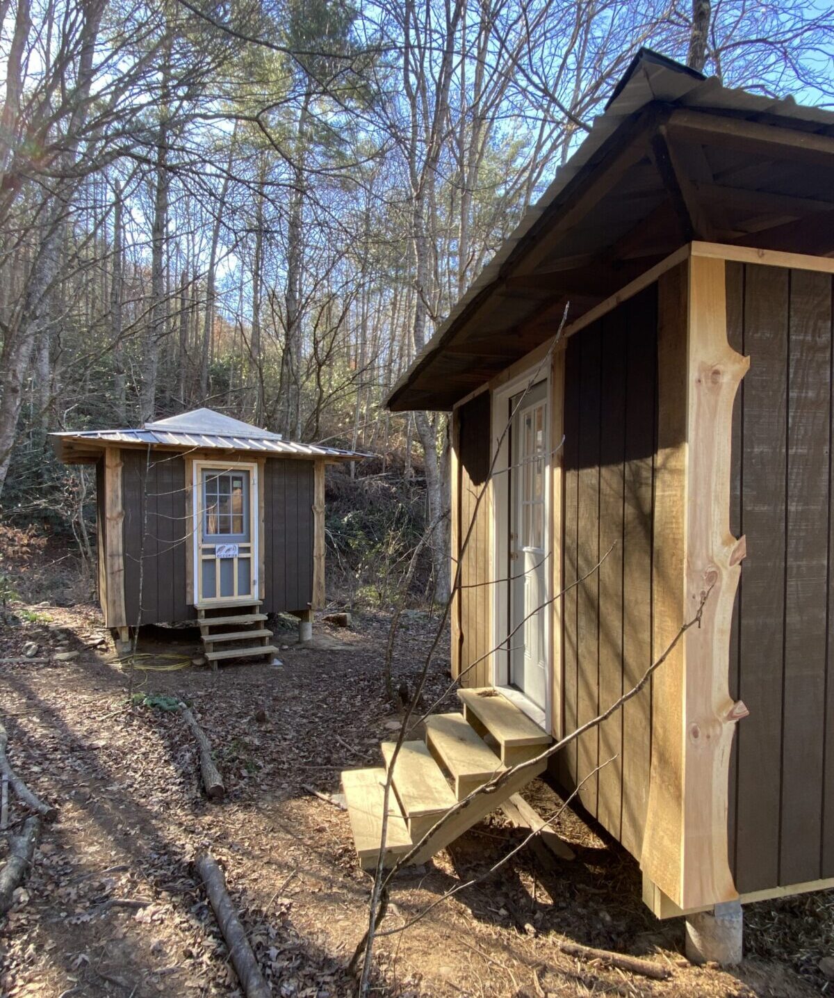 Skyview Private Cottage Sleeping Structures Accommodations Wild Abundance Workshop students on campus 4 available 2026 paint fork only-838 Simple 10x10 sleeping structures are available for Wild Abundance workshop students to book as accommodations for a reasonable fee during workshops if they wish to stay on campus but don't want to bring their own tent for use with the free campsites. A skylight in the ceiling of each cottage provides a lovely view of the forest canopy above.